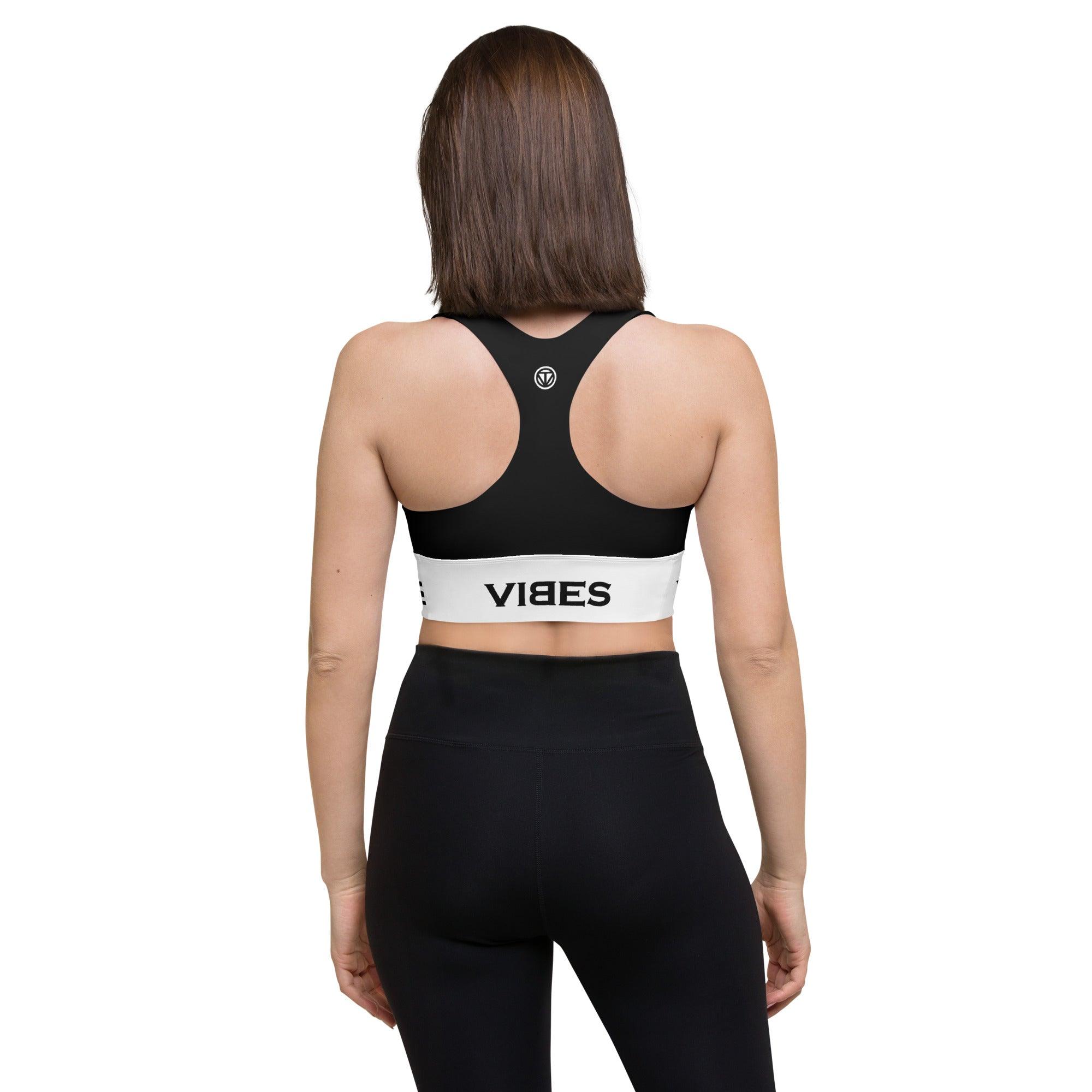 Frau mit schwarzem Sport-BH VIBES und Leggings, Rückansicht, Fitnessmode